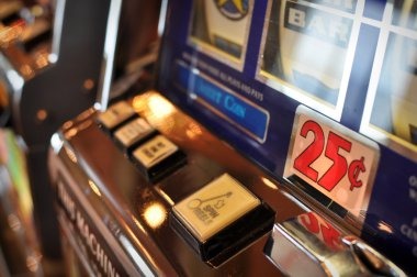 betano Big Bass Bonanza slot game interface on mobile phone screen showing reels and spin button